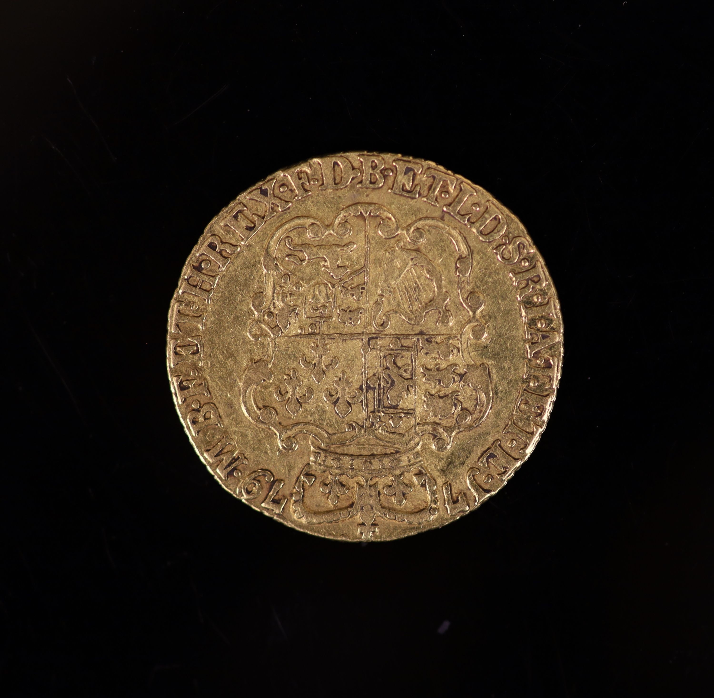 A George III gold guinea 1779, fourth laur. head r., rev. crowned shield of arms (S.3728), AVF